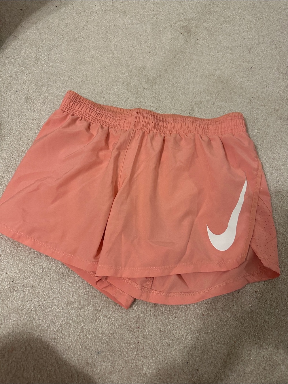 Nike Women's Coral Pink Athletic Running Shorts with White Swoosh